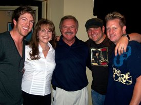 Lorianne and Charlie enjoy a harmonious group hug with Rascal Flatts.